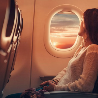 Woman sitting on a flight.